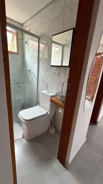 Banheiro privativo do Studio com box de vidro